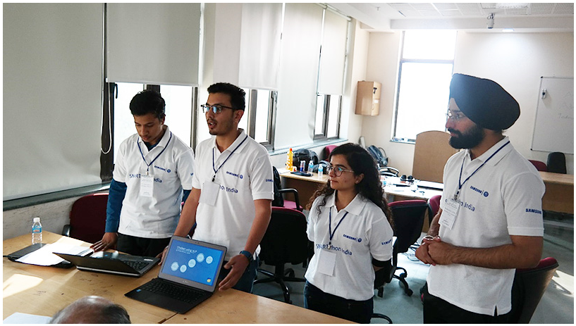 Students giving demo of their projects to the panel of judges during the event